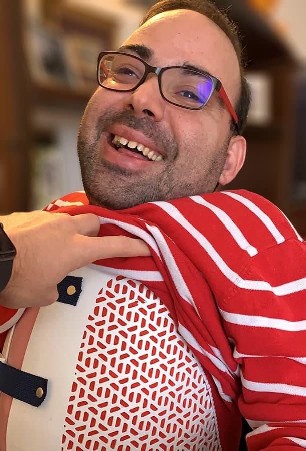 Side view of a black Exos Armor back brace for women